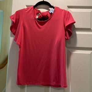 CeCe blouse with flutter sleeves. It has an open back with a bow.